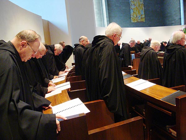 Benedictine monks singing vespers, which is part of the Liturgy of the Hours